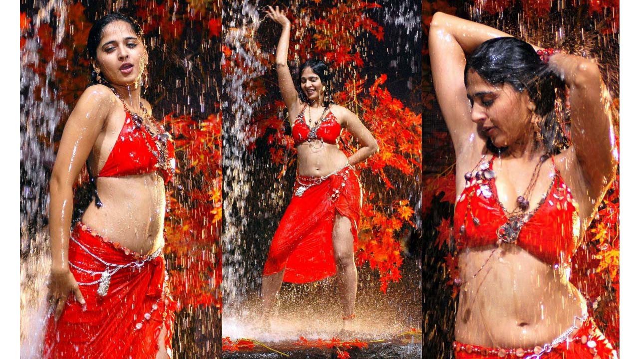 Anushka shetty wet navel exposed in red bikini top and mini skirt..